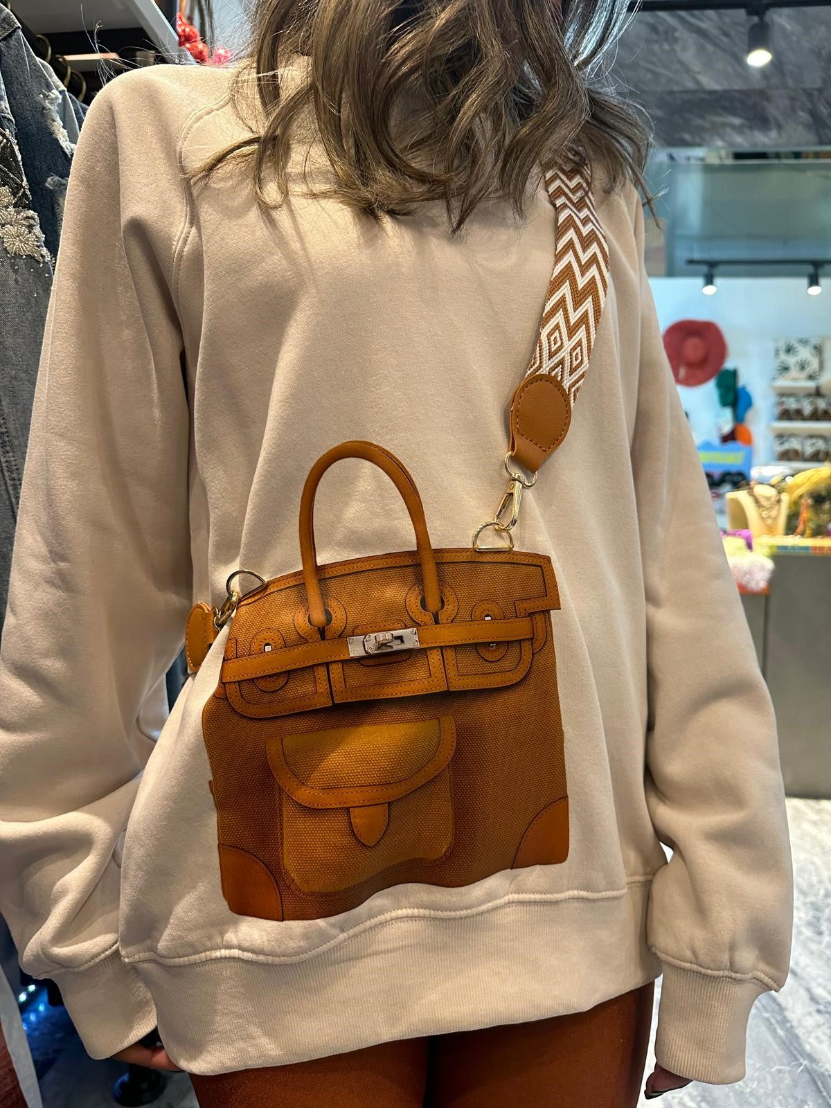 Fancy Brown Bag on a Sweater